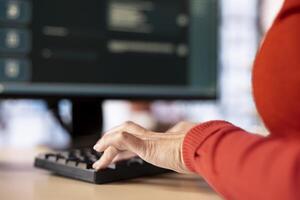 Focused woman working with an AI chatbot on her desktop pc, offering real time assistance and powerful online tools. Advanced system displays how machine learning provides support. photo