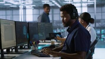 AI system administrator in server room listening music, developing disaster recovery plans ensuring minimal downtime. Neural networks specialist in data center monitoring performance, camera A photo