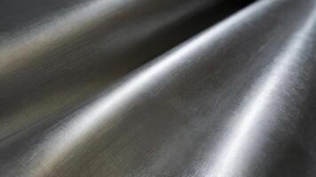Shiny silver foil wave metal texture background photo