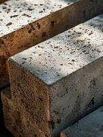Light illuminates rough textured concrete blocks photo
