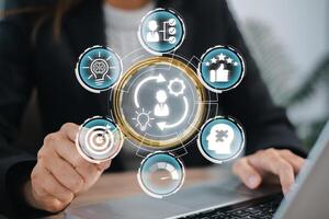 Business professional interacting with digital icons representing competence concepts, skill development, and performance. photo