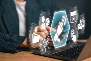 Interactive digital icons and smartphone illustrating a call to action concept in a modern business setting. photo