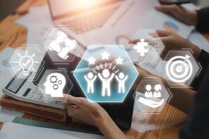 Innovative teambuilding concept showcasing teamwork and collaboration through digital icons in a modern office setting. photo