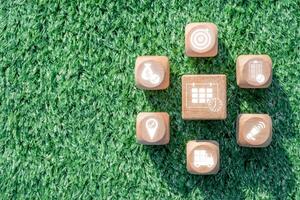 Wooden blocks on grass illustrating key elements of event management, including planning, organization, and coordination. photo