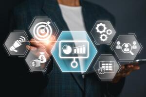 Visual representation of a business plan concept with digital icons and graphs, highlighting strategy and growth. photo