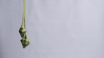 Hanging Ketupat for Ramadan and Eid Mubarak with Copy Space photo