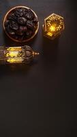 Vintage Islamic Lanterns and A Plate of Dates Fruit or Kurma for Ramadan Decoration photo