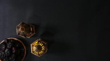 Top View of Islamic Vintage Lanterns and Dates Fruit or Kurma on A Plate photo
