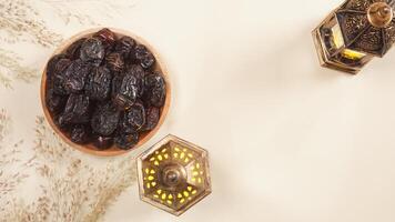 A Plate of Dates With Lighted Islamic Lanterns photo