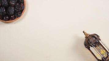 A Plate of Dates and A Lantern for Ramadan and Eid al-Fitr Greeting Concept photo