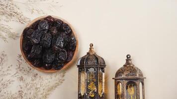 A Plate of Dates With Lanterns and Dry Plants Decoration for Copy Space photo