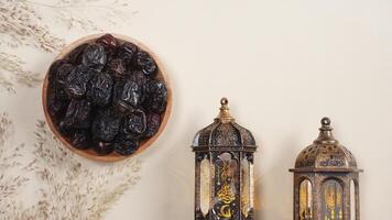 A Plate of Dates, Lanterns, and Dry Plants Decoration With Copy Space Area photo