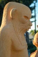 Unveiling ancient artistry in a serene garden at twilight under the whisper of gentle winds photo