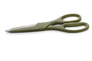 Versatile green scissors resting on a clean surface ready for crafting projects and everyday use photo