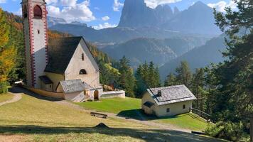 Church of St. Jacob with mountains in the background. Italy video