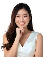 Asian woman smiling with hand on chin photo