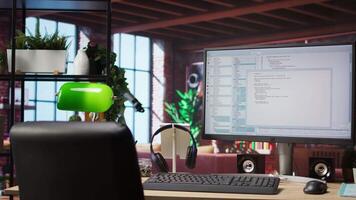 Software development and coding being done on PC, implementing algorithms. Code editor on computer screen in home office used for building applications and optimizing performance video