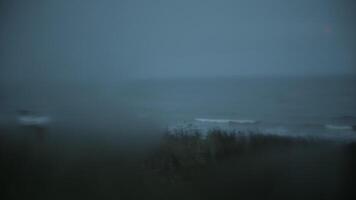 View of foggy coastline through bus window video