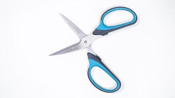 Top View of Open Multipurpose Scissor Isolated on White Background photo