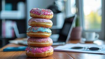Stack of Donuts on a Desk. photo