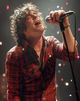 Passionate Singer Performing Live on Stage A Captivating Concert Moment photo