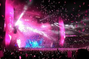 Spectacular Concert Pink Confetti Raining Down on a Huge Crowd at a Stadium Show photo