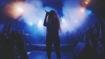 Enthralling Live Music Performance A Female Vocalist Captivates the Crowd in a Smoky Concert Venue photo