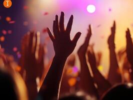 Concert Crowd Euphoric Energy Hands Raised High in Celebration at Live Music Event photo