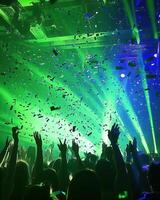 Euphoric Concert A Night of Celebration Under Green Laser Lights and Confetti photo