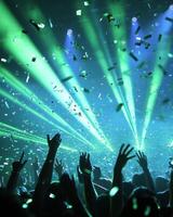 Euphoric Concert Crowd Under Laser Lights and Confetti photo
