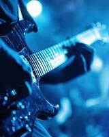 Electrifying Guitar Performance Under Blue Stage Lights A Captivating Close-Up photo