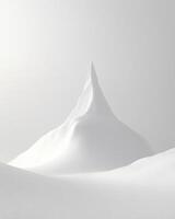 A mountain covered in snow with a large peak photo