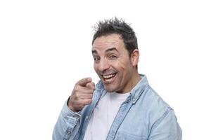 Smiling man pointing and expressing enthusiasm in a bright, cheerful manner against a white background photo