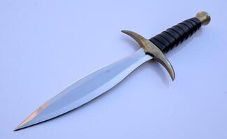 Dagger Double Edge Hunting Knife Isolated with Brass Guard and Leather and Wood Handle photo