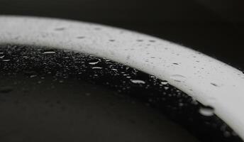 Sprinkled Water Drops On Clean Illuminated Glass After Repellent Coating Macro Shot Stock Photo