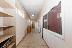 Tranquil Corridor Oasis Tiled Floors and Rectangular Panels Frame a Glimpse into Serenity. photo