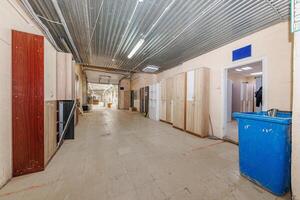 Endless Choices in a Bustling Hallway A Display of Wardrobes Framed by Everyday Elegance and a Touch of Reality photo