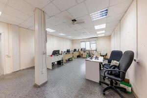 Modern Workspace Serenity A Glimpse into an Organized Office with Minimalist Desks and a Touch of Cast Light photo