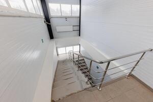 Ascending Serenity A Play of Light and Shadow on a Minimalist Staircase photo