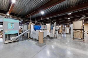 Robust Symphony of Industry A meticulously organized factory interior, showcasing an array of machinery and workstations in perfect harmony, ready for the rhythm of production. photo