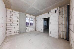 Urban Evolution A Raw Canvas of Exposed Brick and Piping Awaiting Transformation and Design Dreams. photo