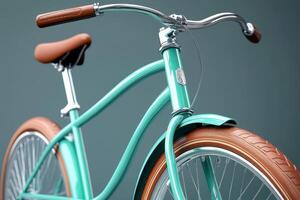 Turquoise bicycle with brown leather seat and handles photo