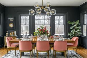 Contemporary dining room with graphite walls, pink chairs and gold accents on the table and tableware photo