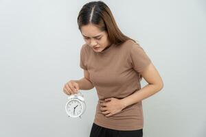 Stomach ache due to eating irregularly, menstrual cramps, flatulence, diarrhea, bloating, bloating, abdominal inflammation, food poisoning, constipation. photo