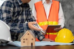 discuss check and review the blueprint of construction. Contractor inspection drawing before start project civil. project planning, consulting, architecture. photo