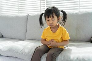 Children have abdominal pain, indigestion, gastritis, menstrual cramps, flatulence, diarrhea, distention, colon cancer, belly inflammation problem, suffer food poisoning, abdomen photo