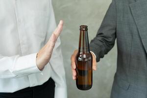 refuses say no and avoid to drink an alcohol whiskey, stopping hand sign male, alcoholism treatment, alcohol addiction, quit booze, Stop Drinking Alcohol. Refuse Glass liquor, unhealthy, reject photo
