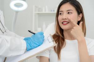 Surgeon or beautician touching woman face, surgical procedure that involve altering shape of nose, doctor examines patient nose before rhinoplasty, medical assistance, health photo