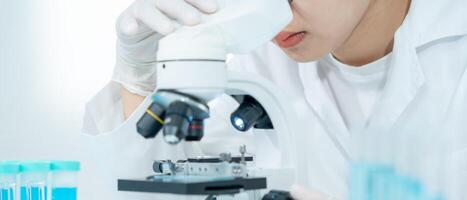 Scientist analyze biochemical samples in advanced scientific laboratory. Medical professional use microscope look microbiological developmental of viral. Biotechnology research photo