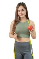 weight scale, results of diet. Beautiful shape. reduced waist size after under going a weight loss corse. balance, control, routines, exercise photo